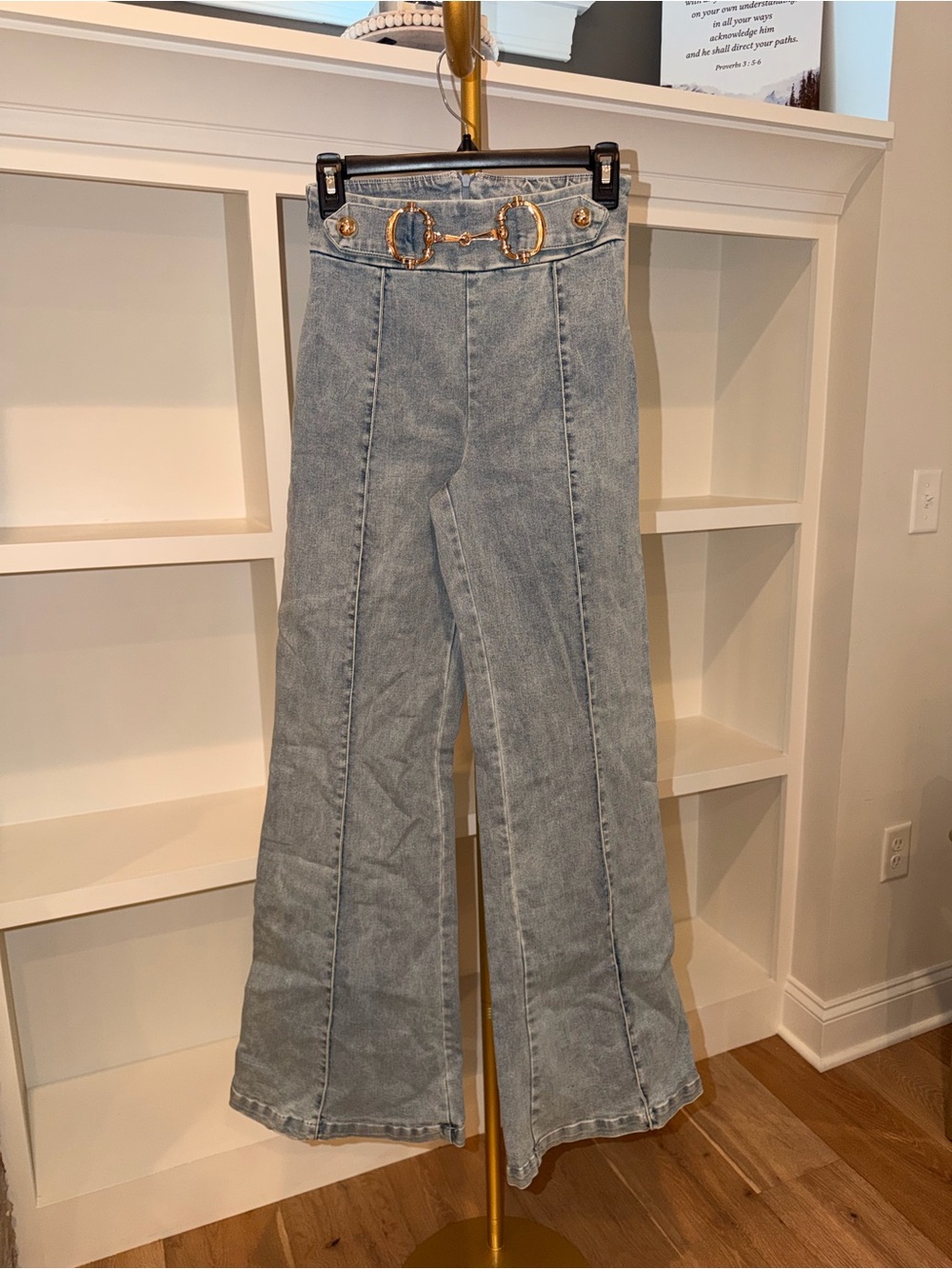 High-Waist Light Blue Women’s Flare Jeans with Decorative Gold Hardware